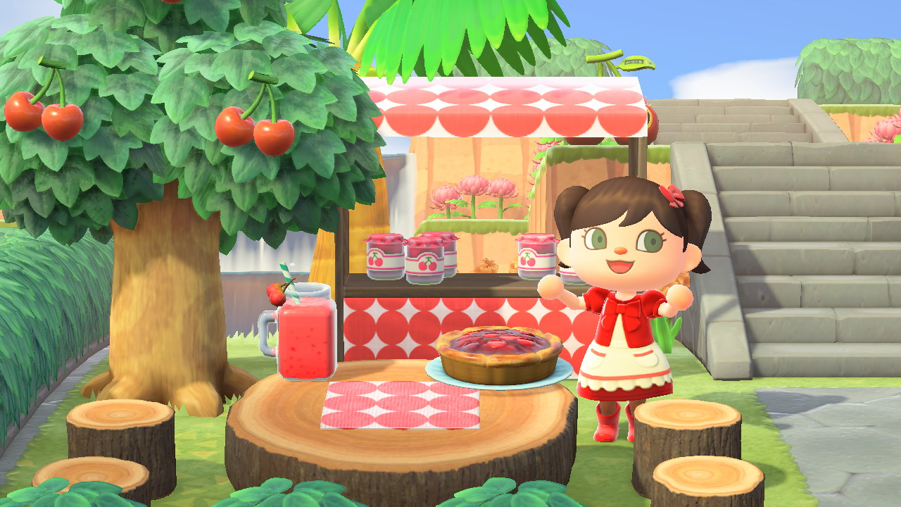 A picture of the cherry stand with a friendly looking staff person.