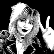 an image of Lauren, the site owner. She has long hair, wears a motorcycle jacket and is smiling while giving the peace sign.