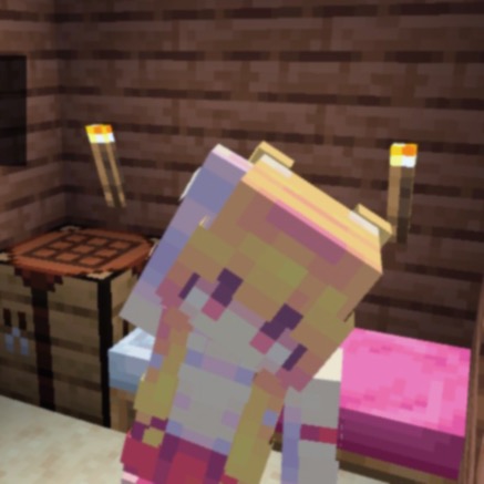 The player is waving to the camera, you can see she is in a small wooden room with a pink bed, crafting table and torches.