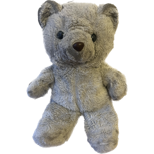 Binky, a stuffed polar bear. He looks worn, but happy still.