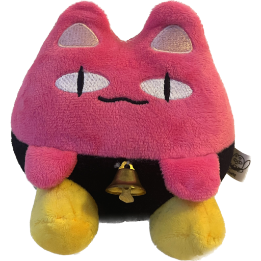 Dinkle, a stuffed animal that looks like a small pink round cat with a raccoon tail, black pants and yellow shoes. He has a mischevious smile! 