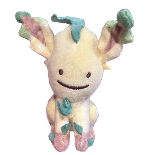 A stuffed version of a Pokemon named Ditto disguising themself as another Pokemon called Leafeon. It resembles a dog crossed with a rabbit, and has leafy elements for its tail and ears. It has the signature goofy smile that gives away the true identity of Ditto.